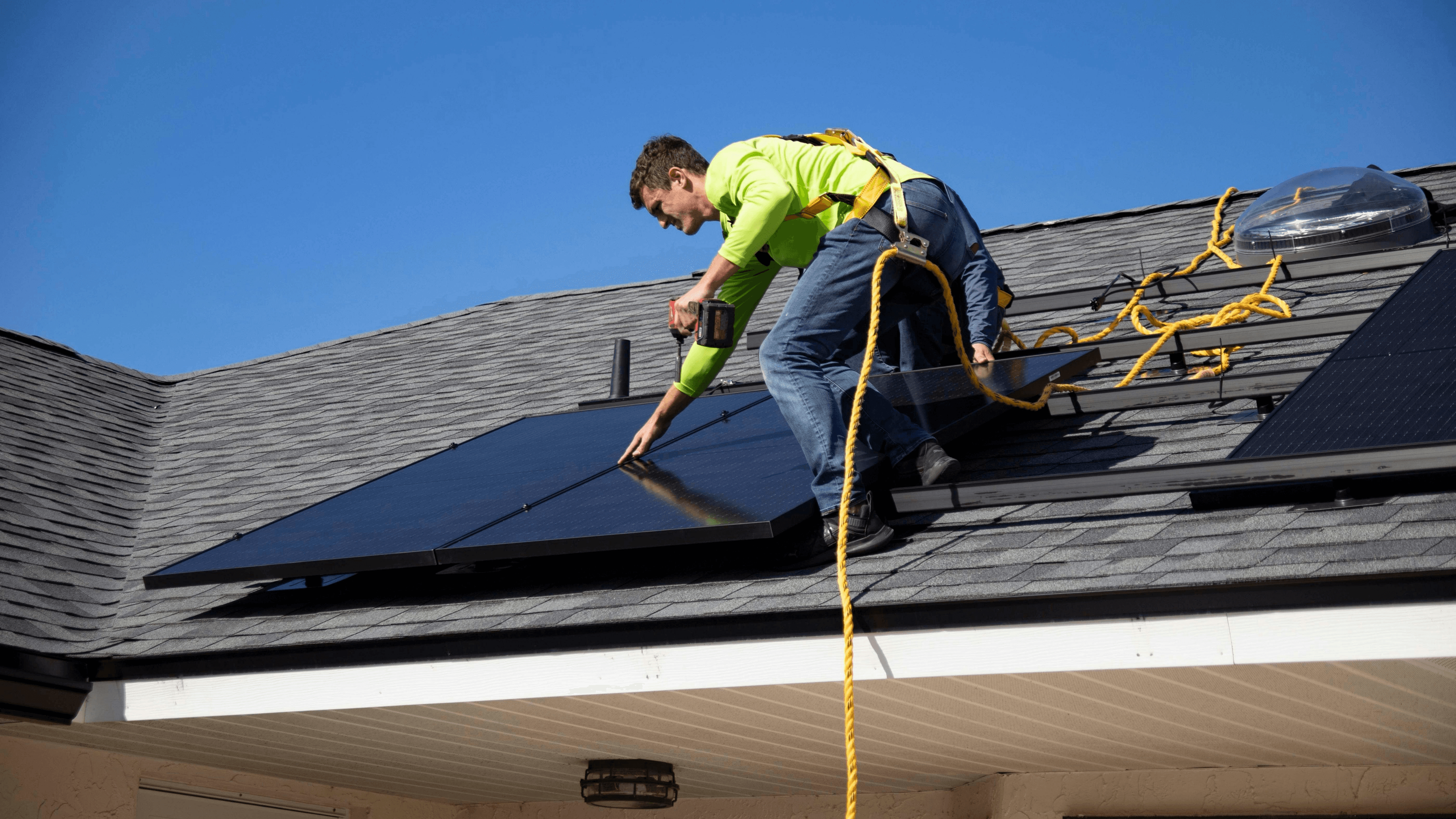 Solar panel being carefully reinstalled on a rooftop